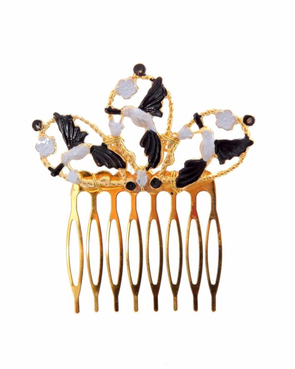 Peinecillo dorado de pájaros pintado en negro y blanco