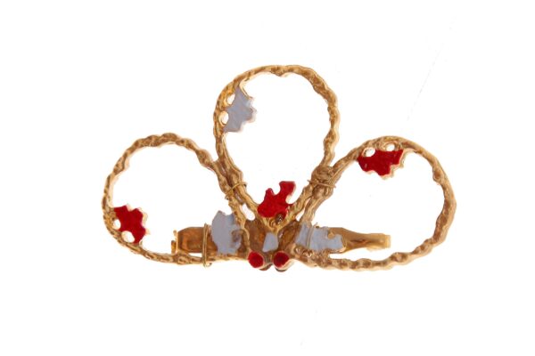Broche dorado pintado en rojo y blanco